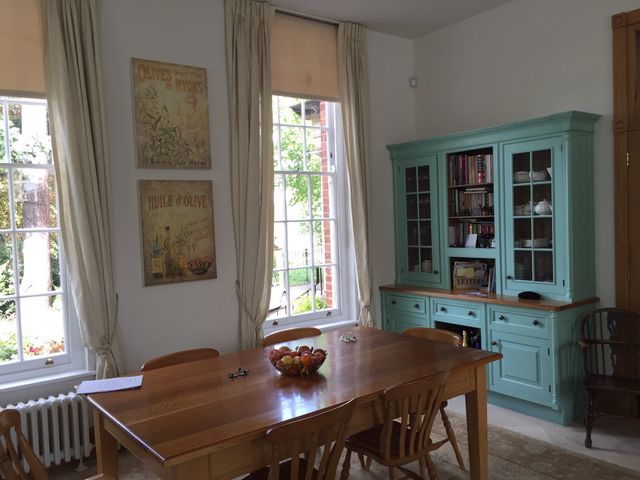 Large dresser painted pale blue-green with glazed upper doors and drawers