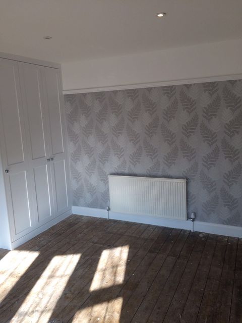 Empty room with new patterned wallpaper