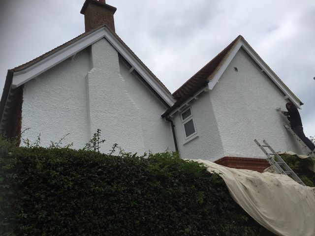 Exterior masonry painted white on a gable end